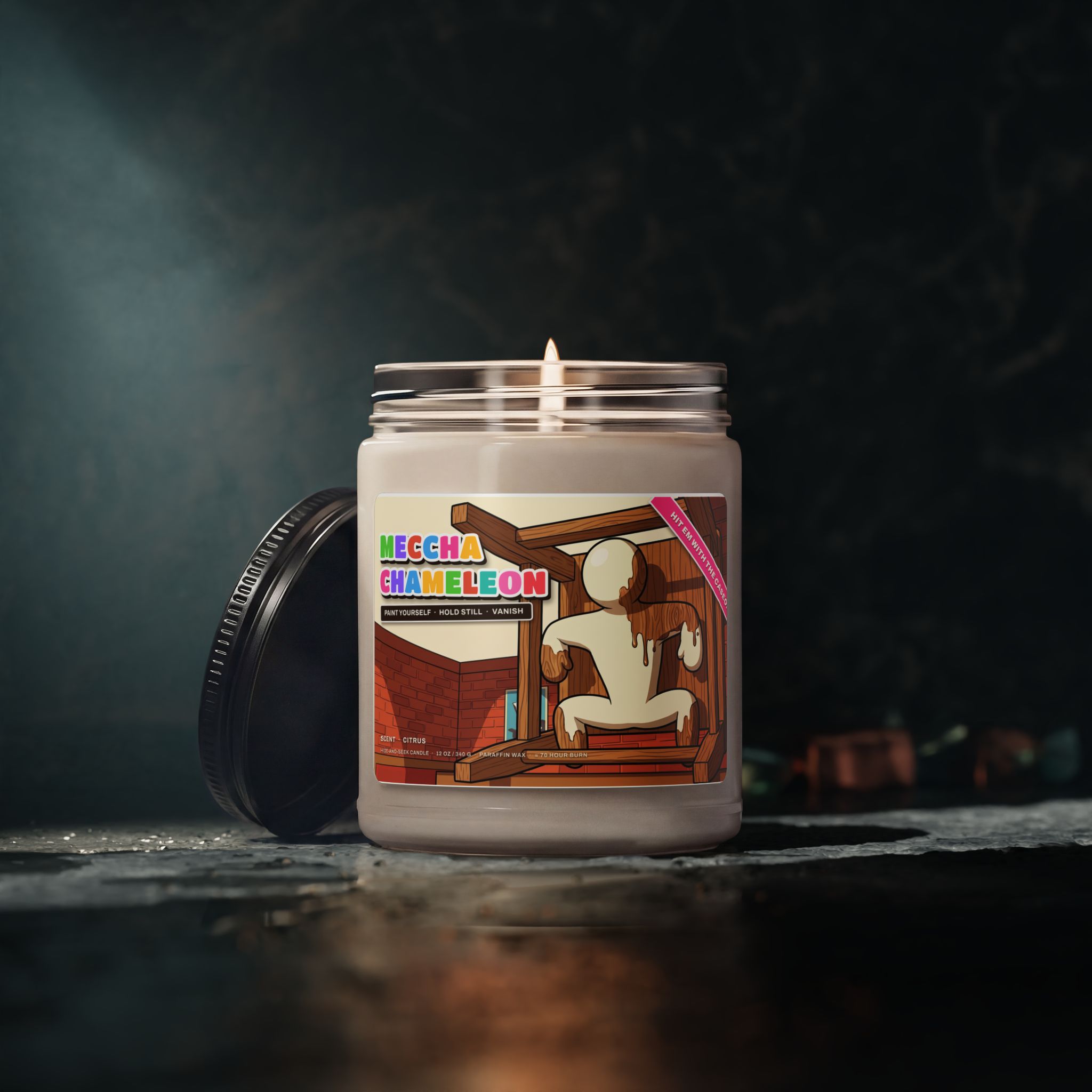 Meccha Chameleon candle burning against a dark moody background