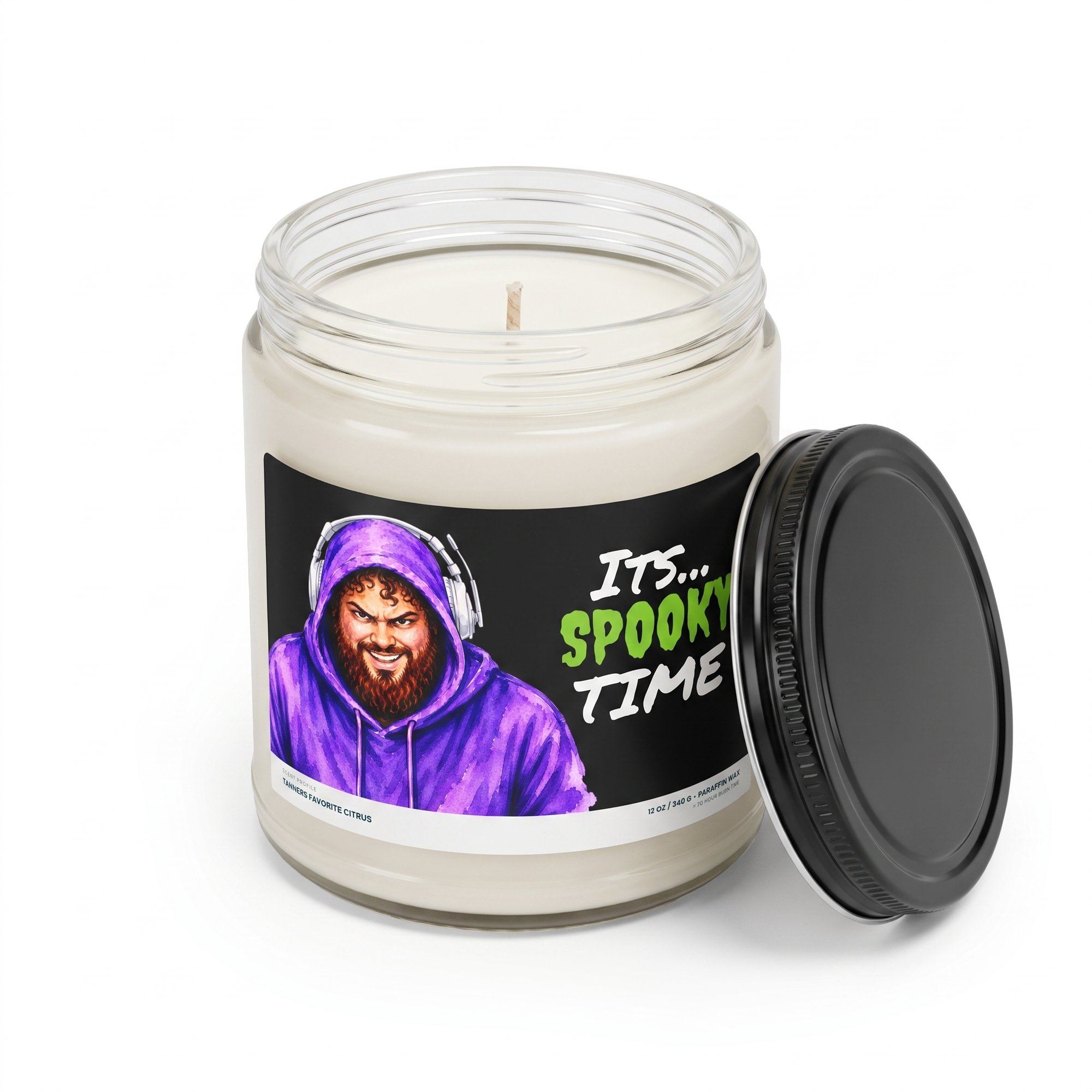 Its Spooky Time candle with the black lid off, showing the white wax and cotton wick