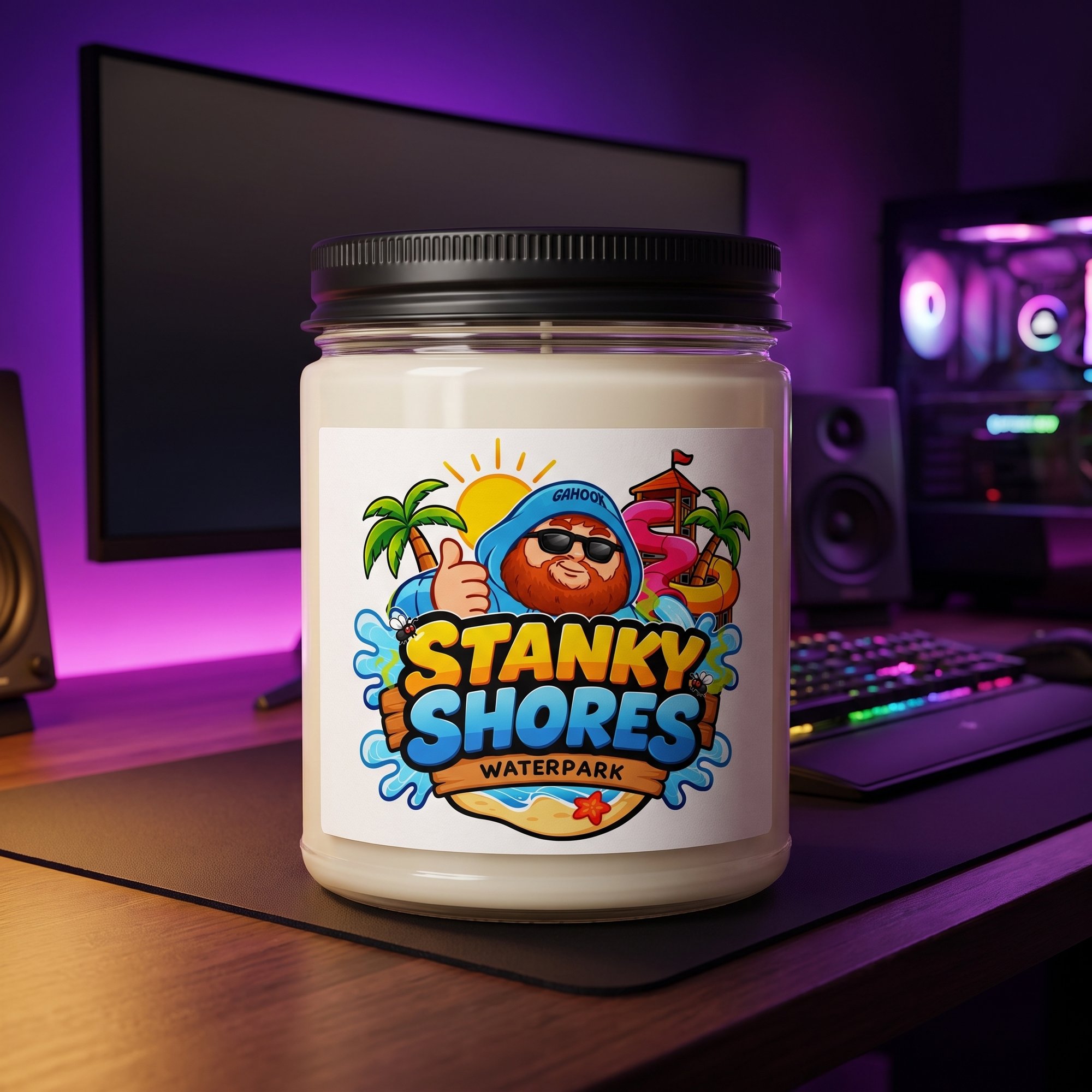Stanky Shores Waterpark candle on a gaming desk, 12 oz paraffin candle in a glass jar