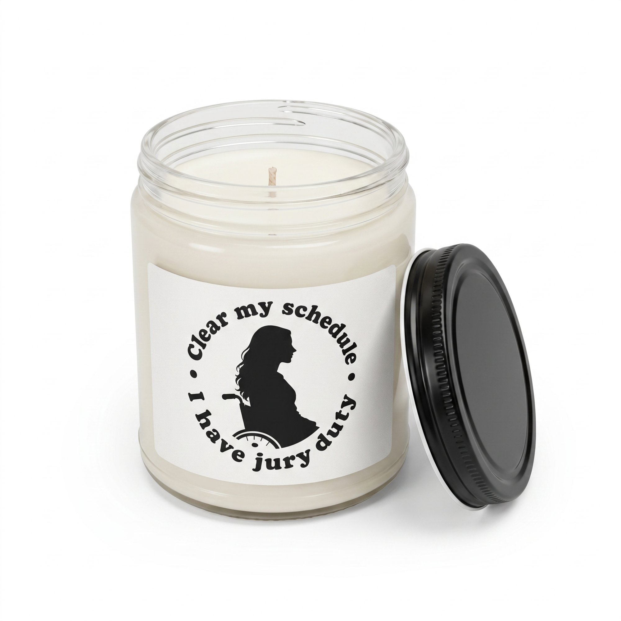 Lindsay Clancy candle with the black lid off, showing the white wax and cotton wick